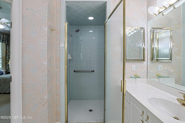 3666 Cypress Point Ct, Green Cove Springs, FL 32043 - ensuite bathroom with a shower stall, vanity, and wallpapered walls