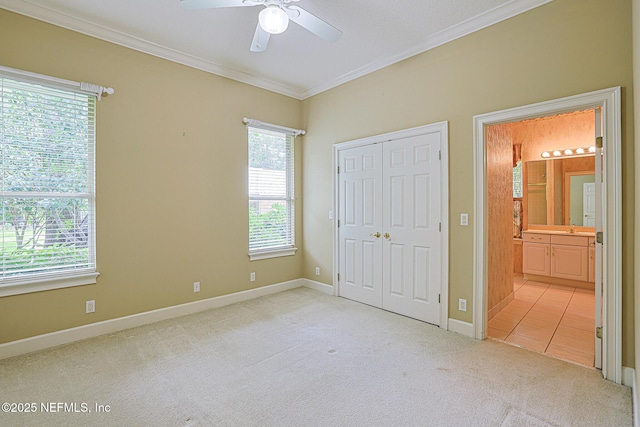 3666 Cypress Point Ct, Green Cove Springs, FL 32043 - unfurnished bedroom with carpet flooring, crown molding, a closet, ensuite bathroom, and a ceiling fan