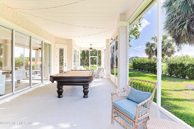 exterior space with a porch and ceiling fan