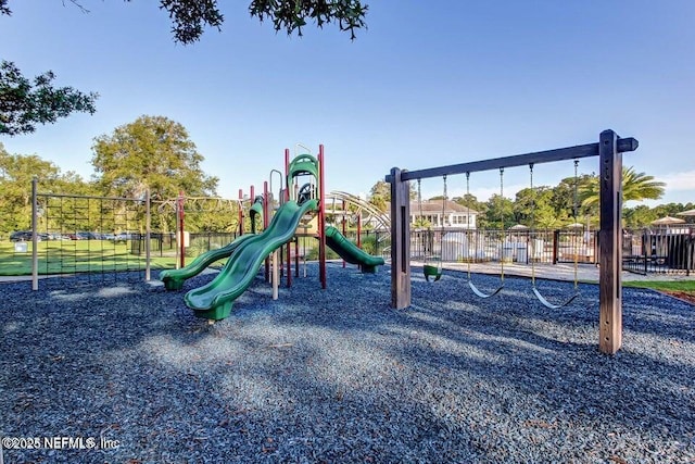 communal playground featuring fence