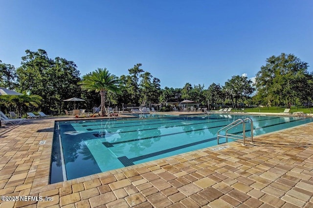 community pool featuring a patio area