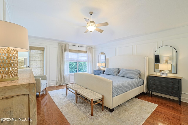bedroom with dark wood-type flooring and ceiling fan