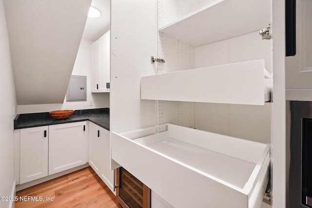 laundry room with light wood-style flooring