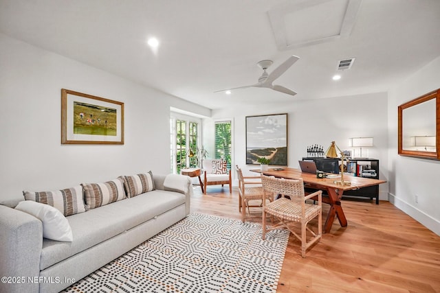 living room with recessed lighting, a ceiling fan, visible vents, and light wood-style flooring