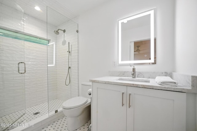 full bath with toilet, a shower stall, and vanity