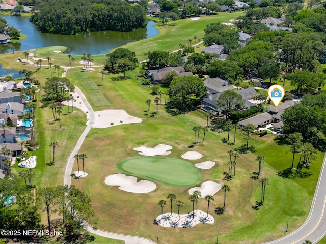 birds eye view of property featuring a water view, a residential view, and golf course view