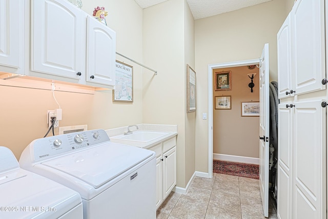 3593 Long Cove Ct, Green Cove Springs, FL 32043 - clothes washing area with washing machine and clothes dryer, baseboards, cabinet space, and a sink