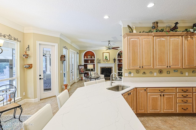 3593 Long Cove Ct, Green Cove Springs, FL 32043 - kitchen with a textured ceiling, light stone counters, ceiling fan, and a sink