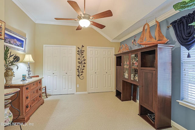 3593 Long Cove Ct, Green Cove Springs, FL 32043 - interior space featuring a ceiling fan, lofted ceiling, baseboards, crown molding, and light colored carpet