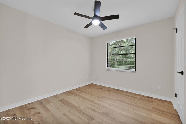 unfurnished room featuring baseboards, a ceiling fan, and light wood-type flooring