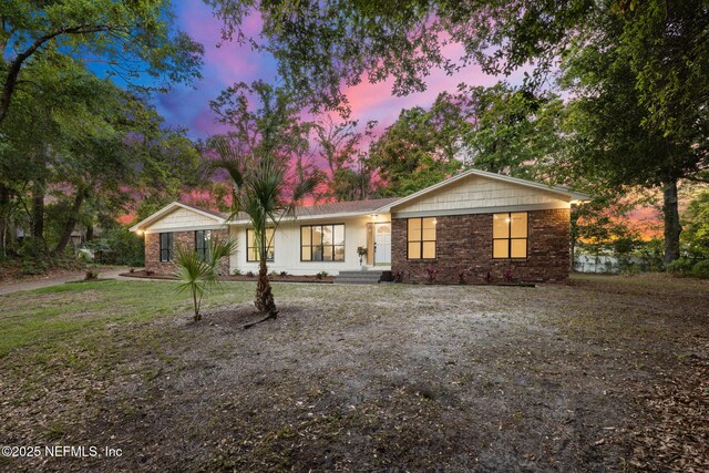single story home with brick siding