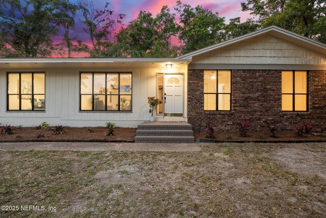 single story home with brick siding