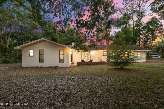 back of house featuring french doors