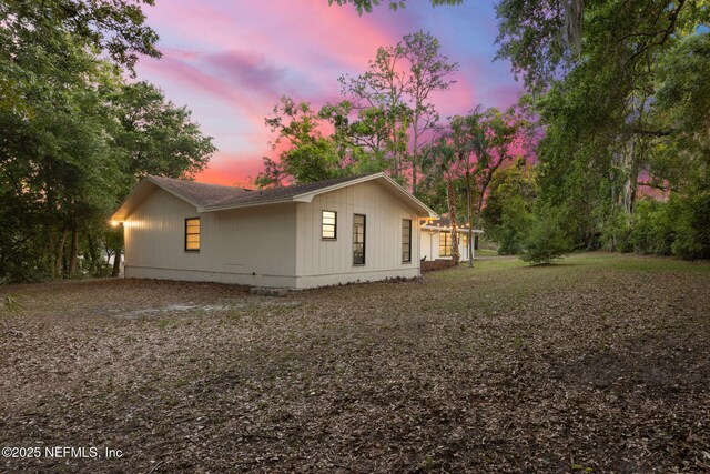 view of property exterior at dusk