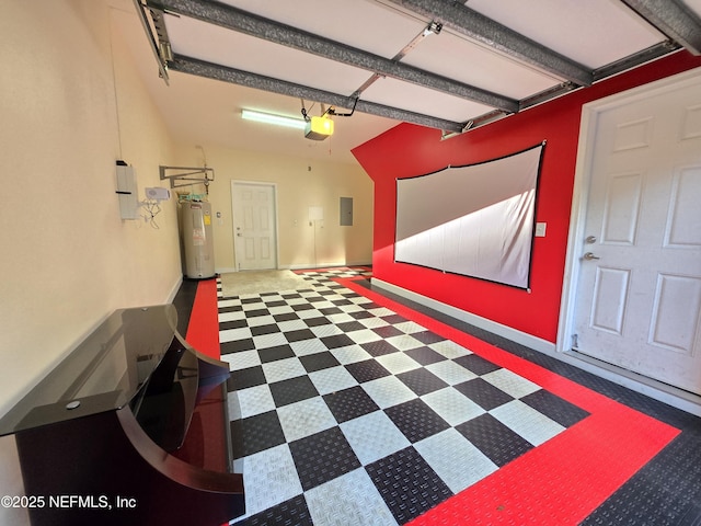 garage featuring baseboards, a garage door opener, water heater, and electric panel