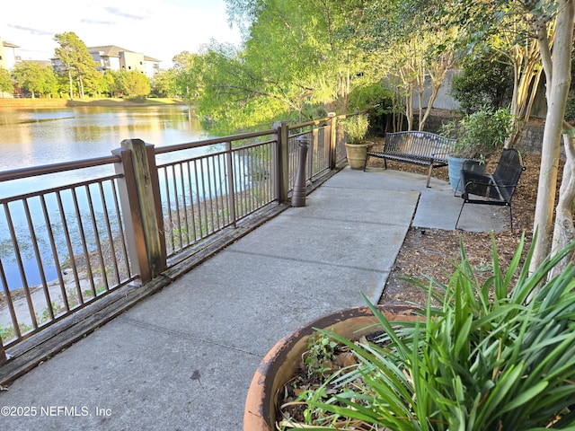 view of patio with a water view