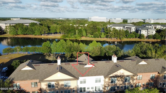 birds eye view of property with a water view