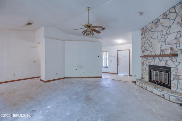 1742 Tiffany Pines Cir E, Jacksonville, FL 32225 - unfurnished living room featuring a fireplace, concrete floors, a ceiling fan, baseboards, and vaulted ceiling