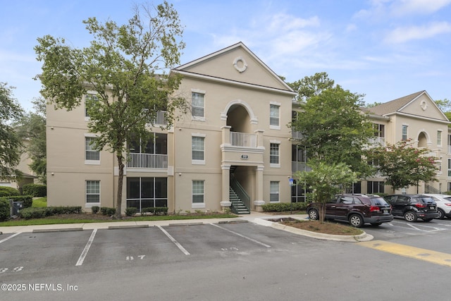 8601 Beach Blvd Unit 323, Jacksonville, FL 32216 - view of building exterior with uncovered parking
