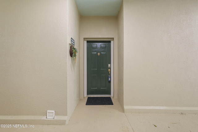 8601 Beach Blvd Unit 323, Jacksonville, FL 32216 - view of exterior entry featuring stucco siding