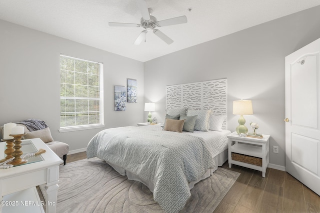 8601 Beach Blvd Unit 323, Jacksonville, FL 32216 - bedroom featuring baseboards, a ceiling fan, and wood finished floors
