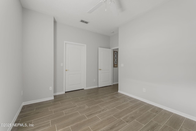 8601 Beach Blvd Unit 323, Jacksonville, FL 32216 - empty room with visible vents, wood tiled floor, baseboards, and ceiling fan