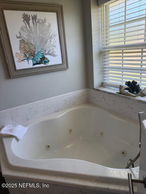 full bath with a jetted tub