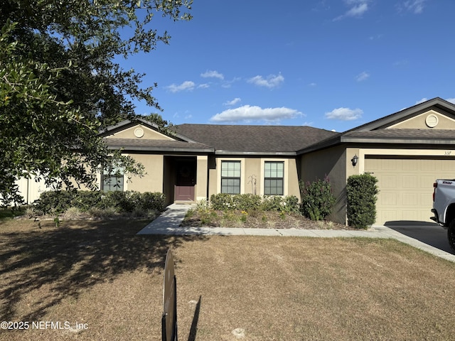 ranch-style home with stucco siding and a garage