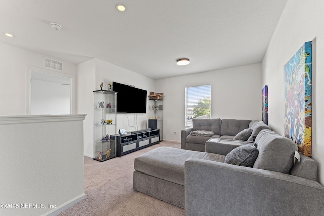 carpeted living room featuring baseboards, recessed lighting, and visible vents