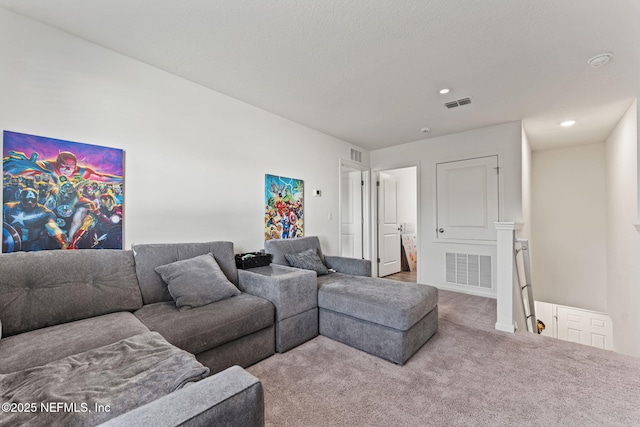 carpeted living area featuring recessed lighting and visible vents