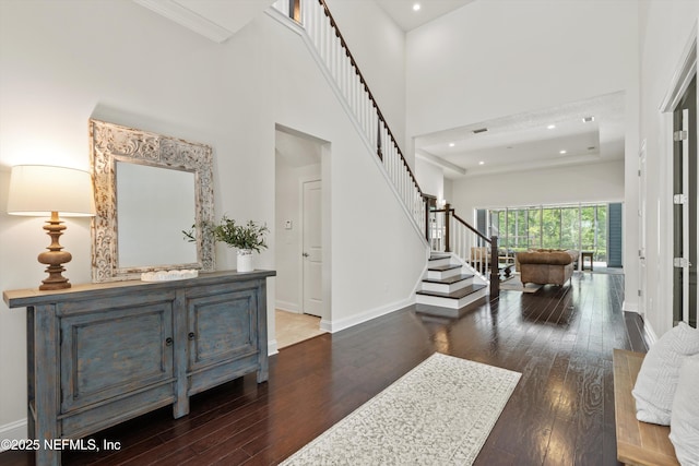 entrance foyer featuring recessed lighting, baseboards, hardwood / wood-style flooring, and stairs