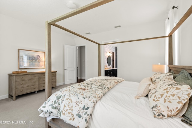carpeted bedroom featuring visible vents and baseboards