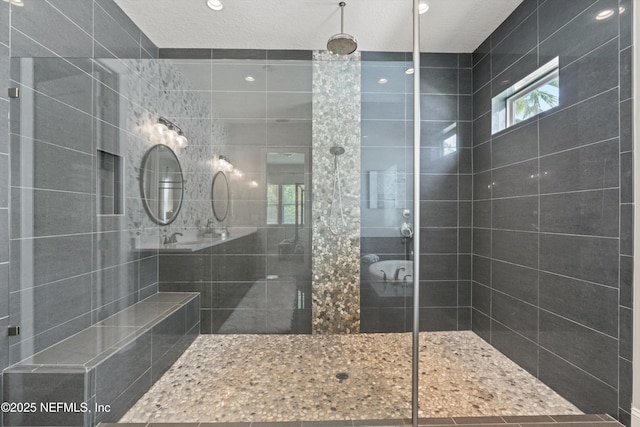 full bath featuring tiled shower