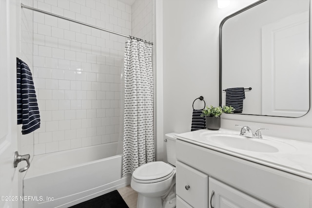 bathroom with vanity, shower / tub combo with curtain, and toilet