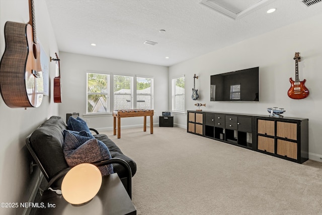 carpeted living room featuring baseboards, recessed lighting, a textured ceiling, and visible vents