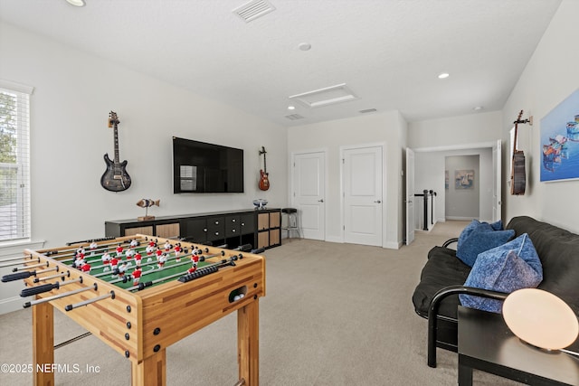 playroom featuring attic access, light colored carpet, visible vents, baseboards, and recessed lighting