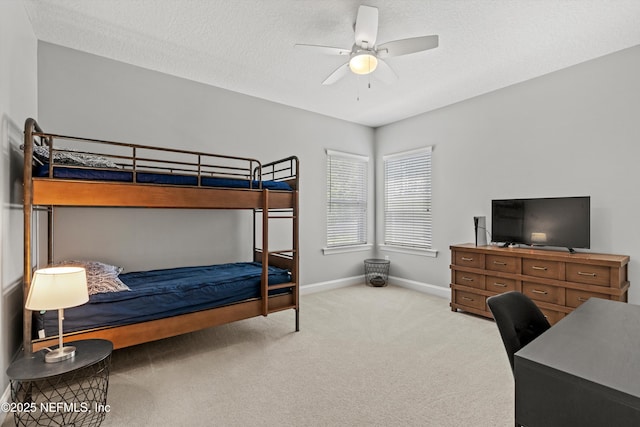bedroom featuring carpet flooring, baseboards, and ceiling fan