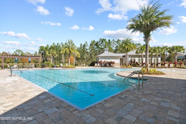 community pool with a patio area