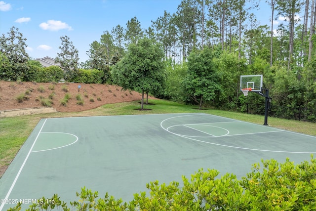 view of sport court featuring a lawn and community basketball court