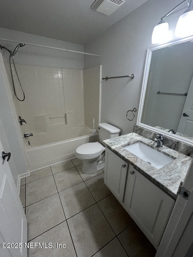 bathroom with toilet, tile patterned floors, vanity, and tub / shower combination