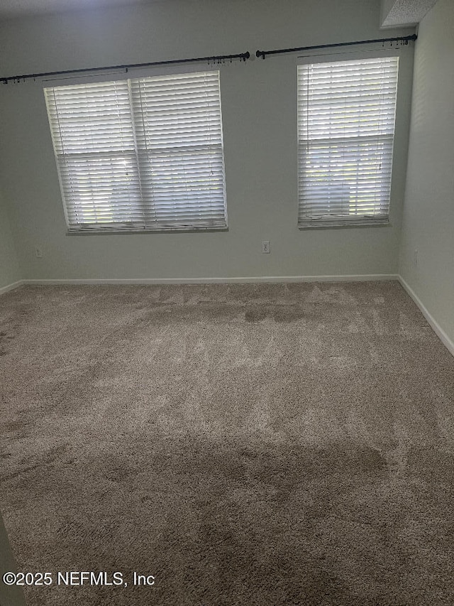 4000 Grande Vista Blvd Unit 15-102, Saint Augustine, FL 32084 - carpeted spare room with baseboards and healthy amount of natural light