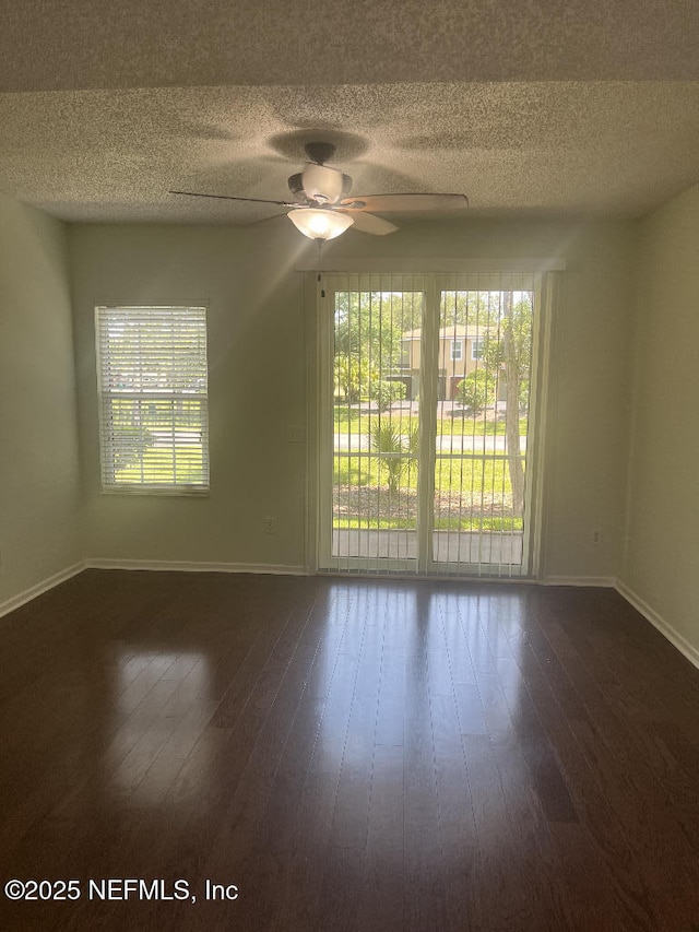 4000 Grande Vista Blvd Unit 15-102, Saint Augustine, FL 32084 - empty room with baseboards, healthy amount of natural light, a textured ceiling, and a ceiling fan