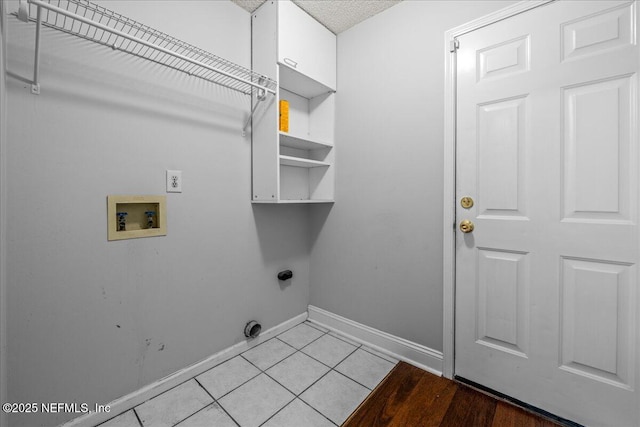 1800 Norway Dr, Fleming Island, FL 32003 - laundry area with washer hookup, baseboards, light tile patterned floors, and electric dryer hookup