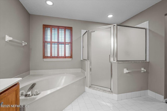 1800 Norway Dr, Fleming Island, FL 32003 - bathroom featuring a garden tub, a shower stall, a textured ceiling, recessed lighting, and tile patterned floors