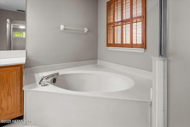 1800 Norway Dr, Fleming Island, FL 32003 - bathroom featuring a garden tub and vanity