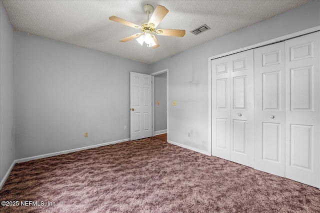 1800 Norway Dr, Fleming Island, FL 32003 - unfurnished bedroom with carpet flooring, a closet, a textured ceiling, and baseboards
