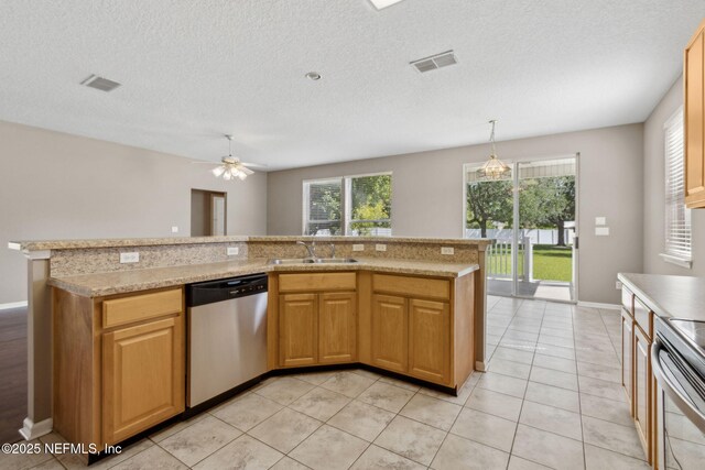 kitchen featuring plenty of natural light, a sink, visible vents, and stainless steel appliances