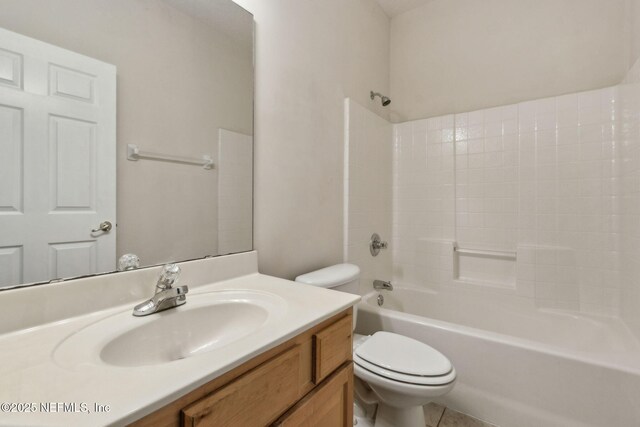 full bath with vanity, tile patterned floors, shower / bathtub combination, and toilet