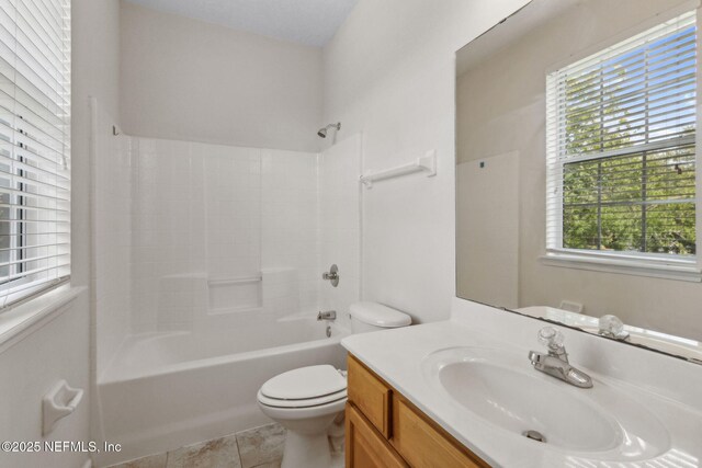full bathroom featuring vanity, shower / bathing tub combination, tile patterned floors, and toilet