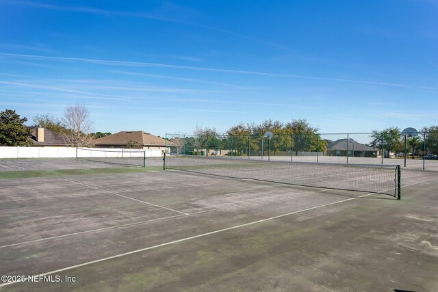 view of sport court with fence